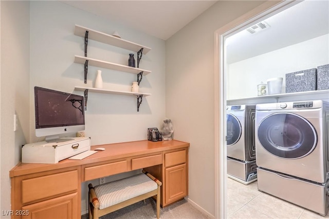 5232 Pendergrass St, North Las Vegas, NV 89081 - washroom featuring washing machine and clothes dryer, a desk, and light tile patterned floors