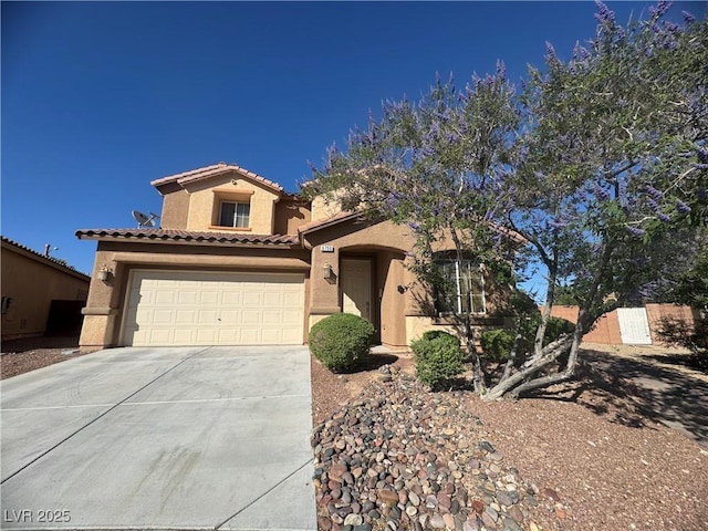 6756 Sea Swallow St, North Las Vegas, NV 89084 - mediterranean / spanish-style home featuring stucco siding, concrete driveway, a tile roof, and an attached garage