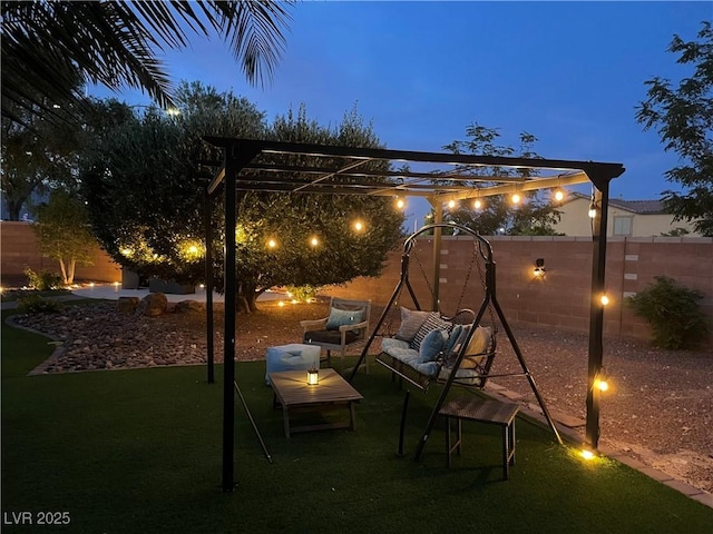 6756 Sea Swallow St, North Las Vegas, NV 89084 - fenced backyard featuring a pergola and outdoor lounge area
