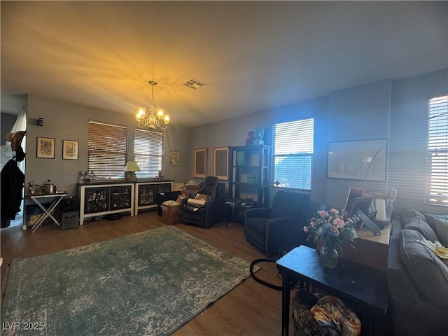 6756 Sea Swallow St, North Las Vegas, NV 89084 - living area with a chandelier, wood finished floors, and plenty of natural light