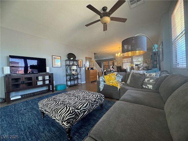 6756 Sea Swallow St, North Las Vegas, NV 89084 - living area with a ceiling fan, a chandelier, and wood finished floors