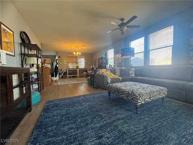 6756 Sea Swallow St, North Las Vegas, NV 89084 - living area with wood finished floors, a chandelier, and a ceiling fan