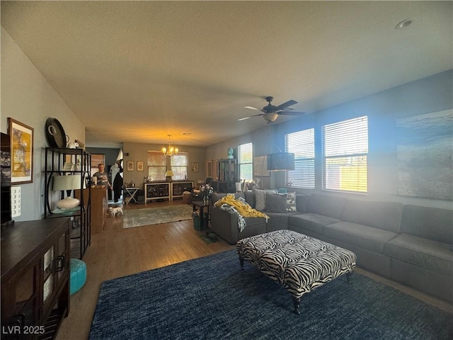 6756 Sea Swallow St, North Las Vegas, NV 89084 - living room with a chandelier, wood finished floors, and ceiling fan