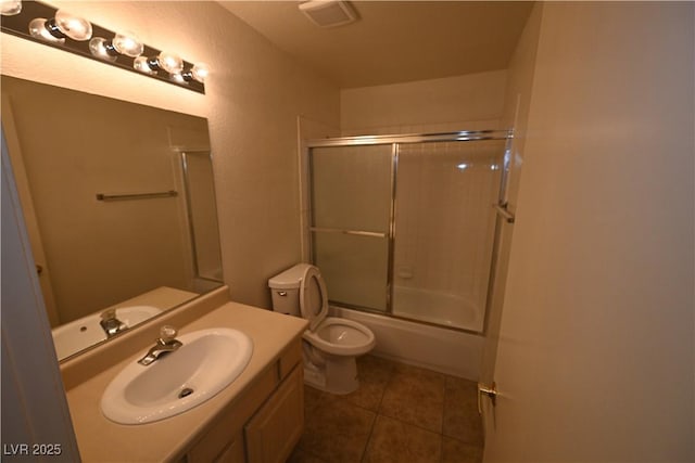 5125 W Reno Ave Unit 1059, Las Vegas, NV 89118 - full bathroom with toilet, vanity, tile patterned floors, and shower / bath combination with glass door
