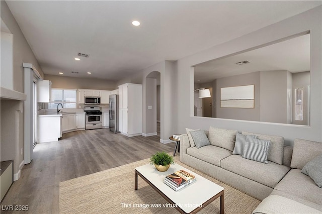 7836 Pinnochio Ave, Las Vegas, NV 89131 - living area with light wood-type flooring, recessed lighting, and baseboards