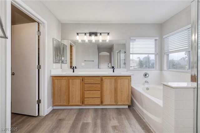 7836 Pinnochio Ave, Las Vegas, NV 89131 - full bath featuring wood finished floors, a garden tub, and double vanity