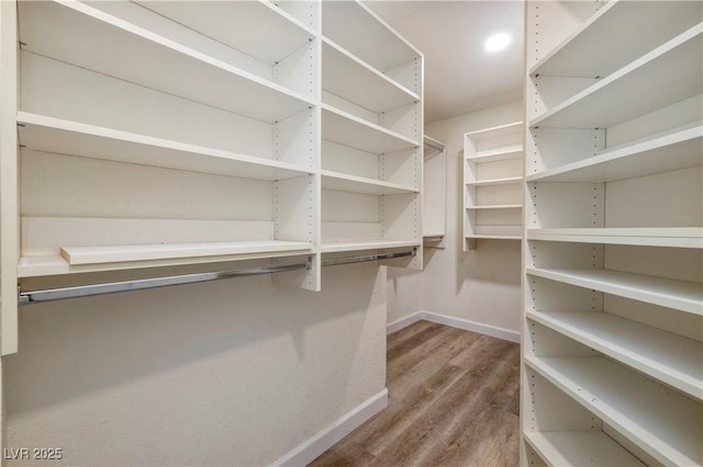 7836 Pinnochio Ave, Las Vegas, NV 89131 - walk in closet featuring wood finished floors