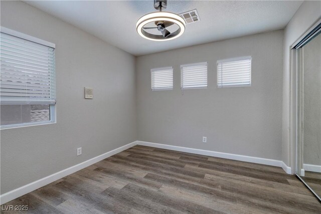 7836 Pinnochio Ave, Las Vegas, NV 89131 - unfurnished bedroom featuring wood finished floors, baseboards, and a closet