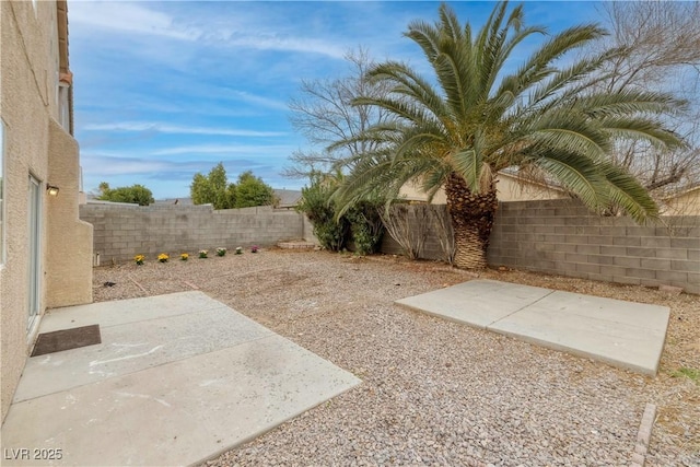 7836 Pinnochio Ave, Las Vegas, NV 89131 - fenced backyard with a patio