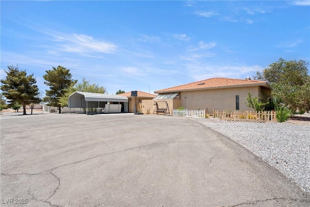 3360 National Ave, Pahrump, NV 89048 - view of front of home with stucco siding and a detached carport