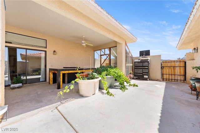 3360 National Ave, Pahrump, NV 89048 - view of patio featuring a ceiling fan and a gate