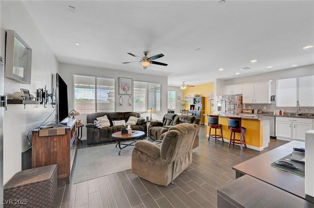 1120 Via Della Curia, Henderson, NV 89011 - living room with a ceiling fan, dark wood-style flooring, and recessed lighting