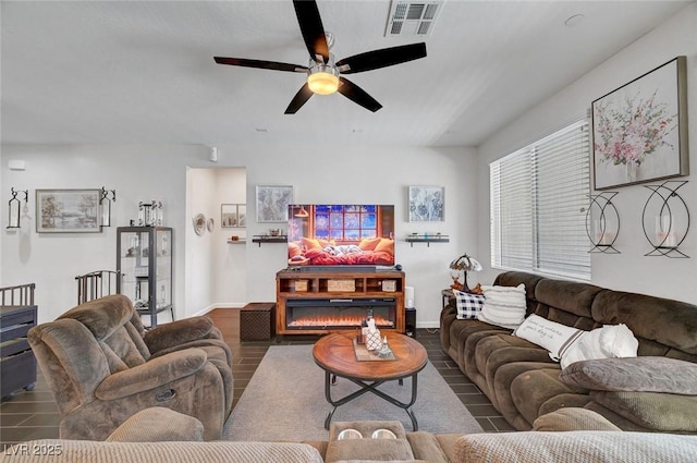1120 Via Della Curia, Henderson, NV 89011 - living area featuring a ceiling fan, wood finished floors, and baseboards