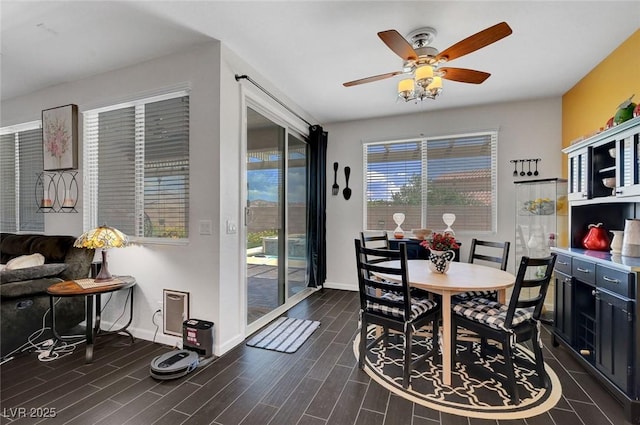 1120 Via Della Curia, Henderson, NV 89011 - dining area featuring ceiling fan, baseboards, and dark wood-style flooring