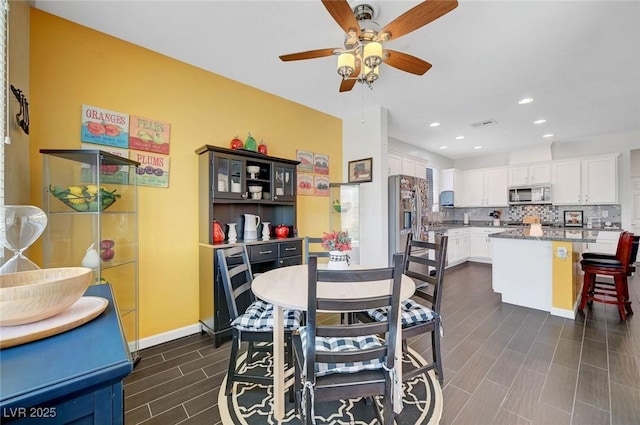 1120 Via Della Curia, Henderson, NV 89011 - dining area with a ceiling fan, recessed lighting, baseboards, and dark wood-style flooring