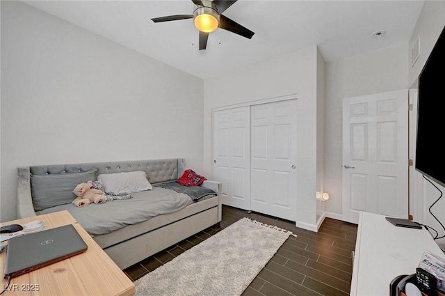 1120 Via Della Curia, Henderson, NV 89011 - bedroom featuring wood finish floors, a closet, baseboards, and ceiling fan