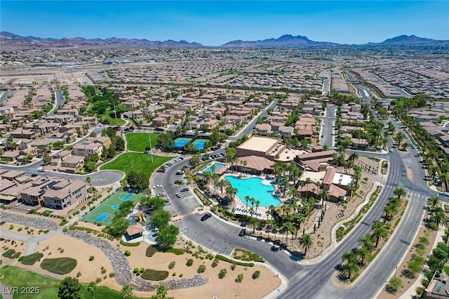 1120 Via Della Curia, Henderson, NV 89011 - view of property location featuring a mountain backdrop, a pool, and nearby suburban area