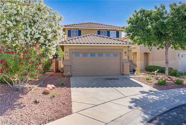 305 Napa Hills Dr, Las Vegas, NV 89144 - mediterranean / spanish-style home with stucco siding, a tile roof, concrete driveway, and an attached garage