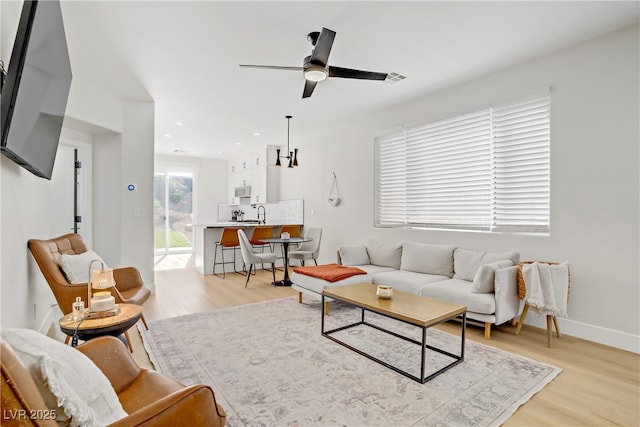 305 Napa Hills Dr, Las Vegas, NV 89144 - living area featuring light wood-style flooring and ceiling fan