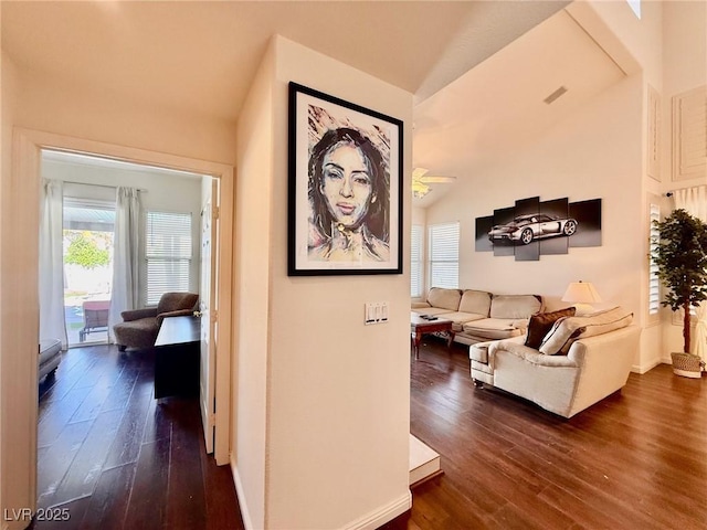 1704 Cordoba Canyon St, Las Vegas, NV 89117 - living area with dark wood-type flooring, lofted ceiling, and baseboards