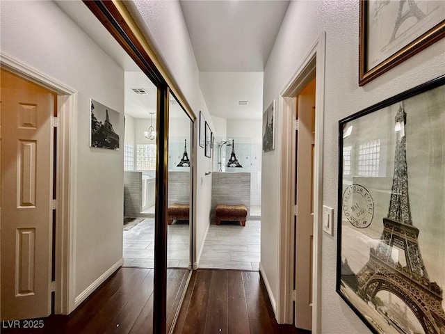 1704 Cordoba Canyon St, Las Vegas, NV 89117 - hall featuring dark wood-style flooring and baseboards
