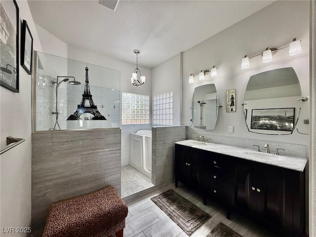 1704 Cordoba Canyon St, Las Vegas, NV 89117 - full bath with a walk in shower, a tub, double vanity, and a chandelier