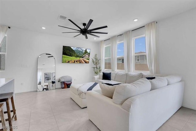 10292 Fragrant Apple Ct, Las Vegas, NV 89141 - living area with light tile patterned flooring, ceiling fan, recessed lighting, and arched walkways