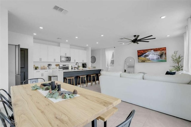 10292 Fragrant Apple Ct, Las Vegas, NV 89141 - dining room with recessed lighting, a ceiling fan, and light tile patterned flooring