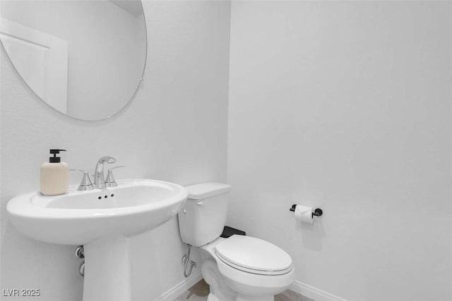 10292 Fragrant Apple Ct, Las Vegas, NV 89141 - bathroom featuring baseboards and toilet