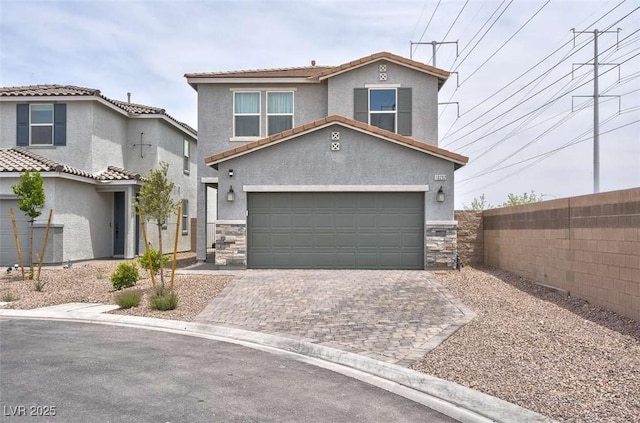 10292 Fragrant Apple Ct, Las Vegas, NV 89141 - view of front of property featuring stone siding, driveway, stucco siding, an attached garage, and a tile roof