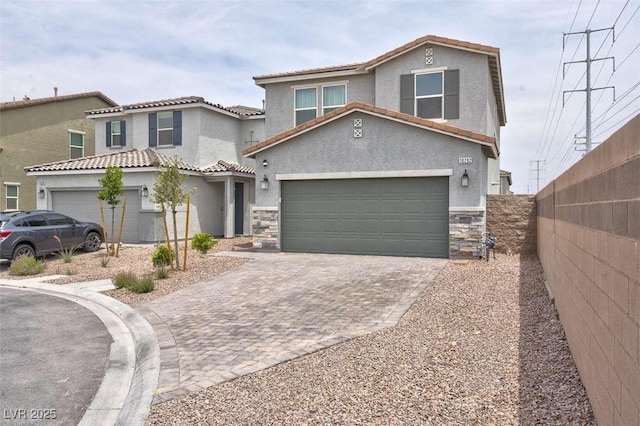 10292 Fragrant Apple Ct, Las Vegas, NV 89141 - view of front facade featuring stucco siding, stone siding, driveway, and a tile roof