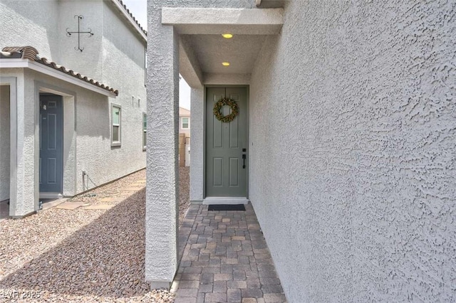 10292 Fragrant Apple Ct, Las Vegas, NV 89141 - entrance to property with stucco siding and a tiled roof