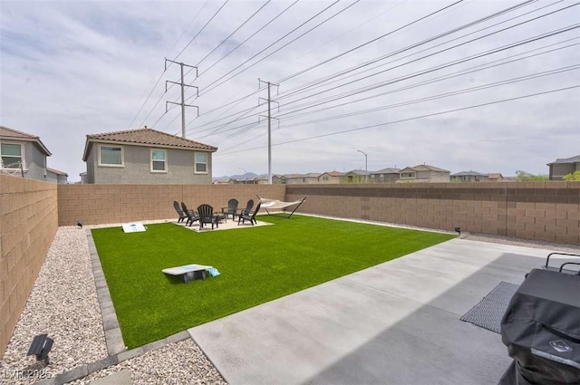 10292 Fragrant Apple Ct, Las Vegas, NV 89141 - view of yard featuring a patio area and a fire pit