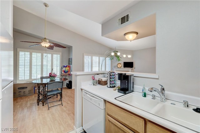 8450 Alta Dr Unit 204, Las Vegas, NV 89145 - kitchen featuring dishwasher, a sink, light countertops, light wood finished floors, and ceiling fan