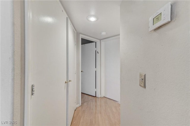 8450 Alta Dr Unit 204, Las Vegas, NV 89145 - corridor with light wood finished floors