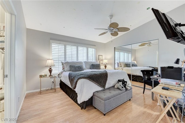 8450 Alta Dr Unit 204, Las Vegas, NV 89145 - bedroom featuring light wood-style floors, lofted ceiling, a closet, ceiling fan, and baseboards