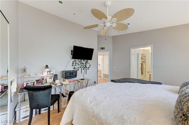 8450 Alta Dr Unit 204, Las Vegas, NV 89145 - bedroom featuring light wood finished floors, connected bathroom, and ceiling fan