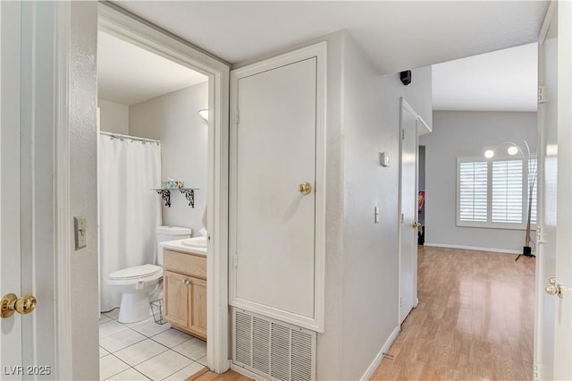 8450 Alta Dr Unit 204, Las Vegas, NV 89145 - full bathroom with vanity, toilet, wood finished floors, and curtained shower