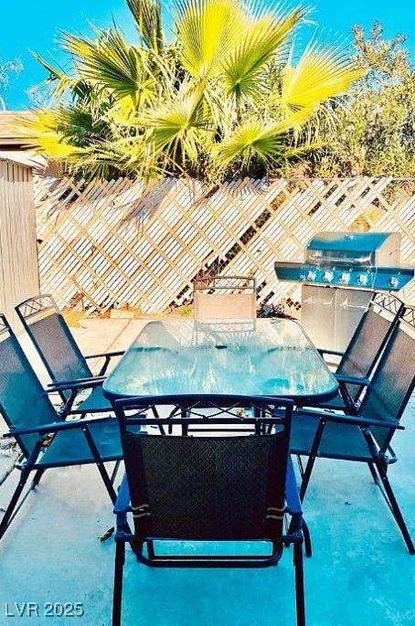 6320 Shawnee Ave, Las Vegas, NV 89107 - view of pool featuring outdoor dining area and a fenced backyard