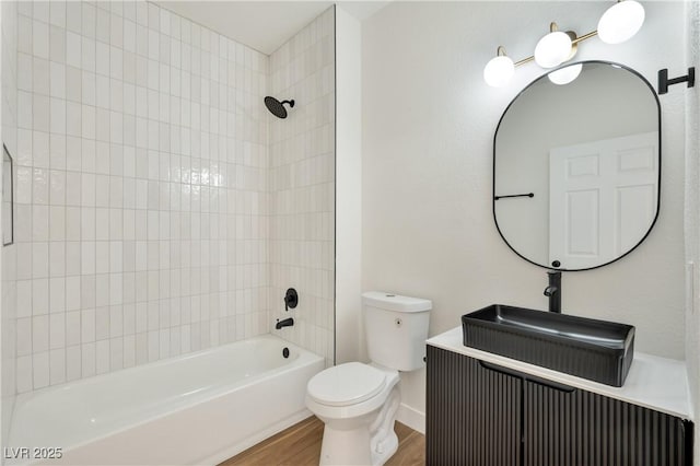 3318 N Decatur Blvd Unit 1107, Las Vegas, NV 89130 - full bathroom featuring toilet, vanity, wood finished floors,  shower combination, and baseboards