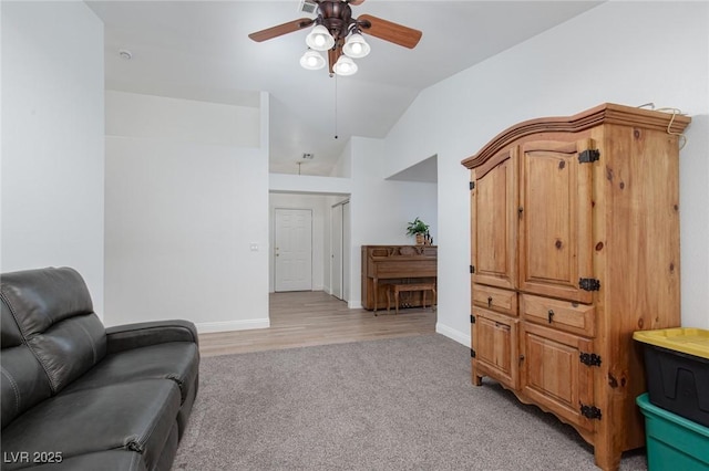 1835 Banaba Ln, Las Vegas, NV 89156 - living area with ceiling fan, vaulted ceiling, light colored carpet, and baseboards