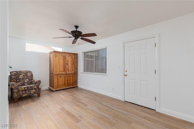 1835 Banaba Ln, Las Vegas, NV 89156 - living area featuring ceiling fan, light wood-style flooring, and baseboards