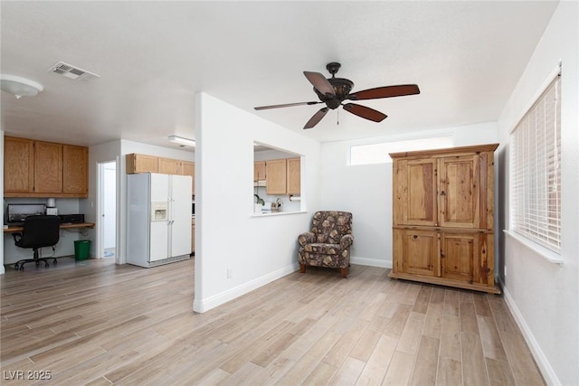1835 Banaba Ln, Las Vegas, NV 89156 - living area featuring ceiling fan, light wood-type flooring, and baseboards