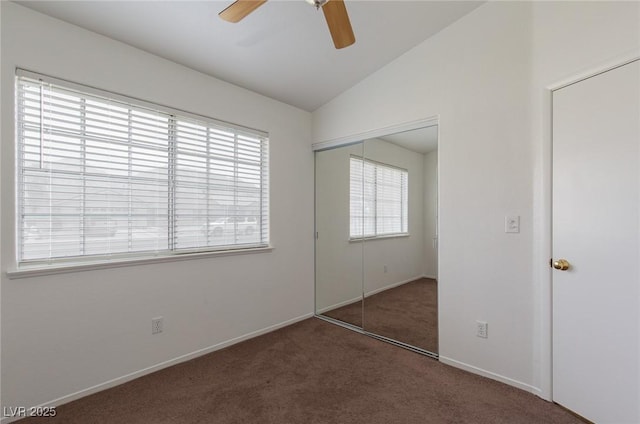 1835 Banaba Ln, Las Vegas, NV 89156 - unfurnished bedroom with multiple windows, carpet, vaulted ceiling, a closet, and baseboards