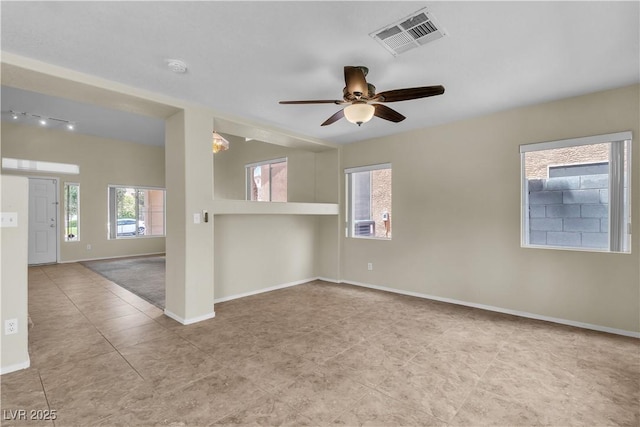 682 E Sole Addiction Ave, Las Vegas, NV 89183 - tiled spare room with baseboards, a ceiling fan, a smoke detector, and track lighting