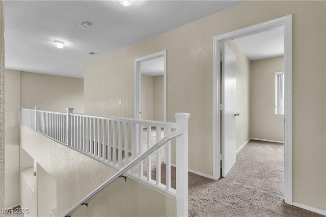 682 E Sole Addiction Ave, Las Vegas, NV 89183 - hall with carpet, an upstairs landing, and baseboards