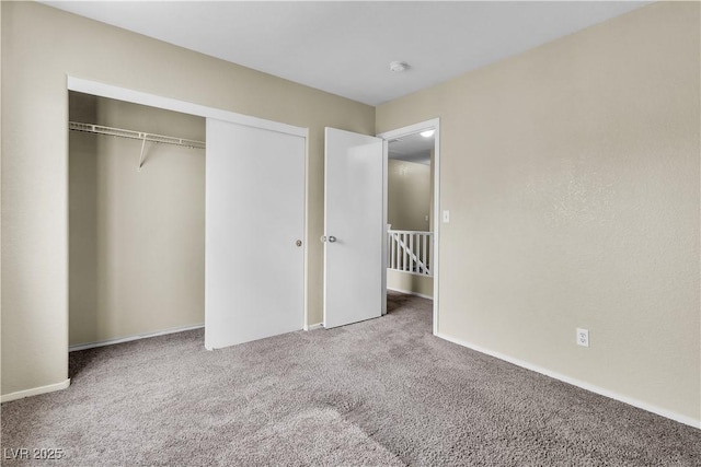 682 E Sole Addiction Ave, Las Vegas, NV 89183 - unfurnished bedroom featuring carpet, a closet, and baseboards