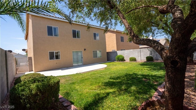 682 E Sole Addiction Ave, Las Vegas, NV 89183 - back of property with stucco siding and a patio