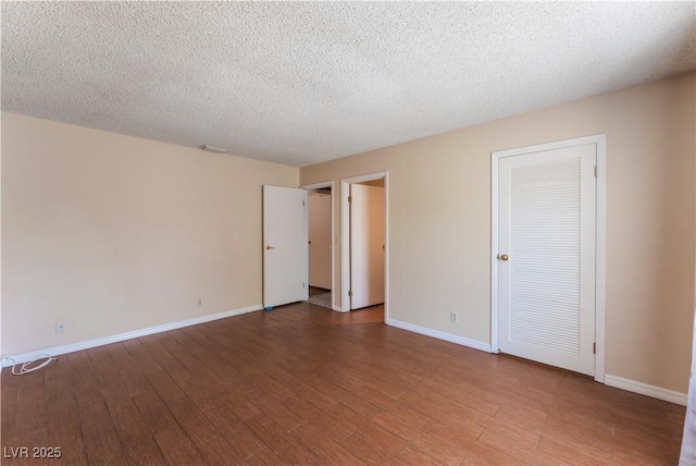 1470 Elizabeth Ave Unit 1, Las Vegas, NV 89119 - unfurnished room featuring wood finished floors, baseboards, and a textured ceiling