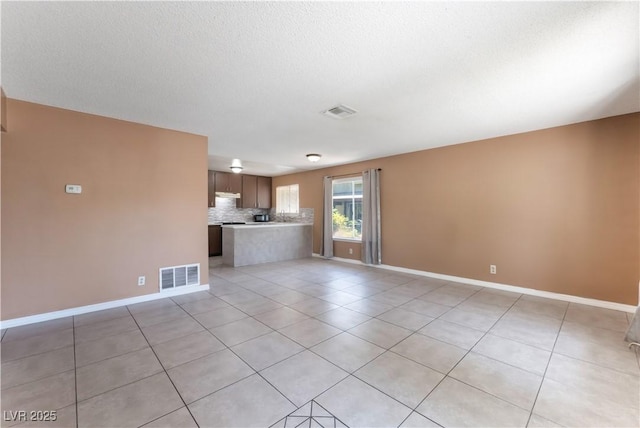 1470 Elizabeth Ave Unit 1, Las Vegas, NV 89119 - unfurnished living room featuring light tile patterned floors and baseboards